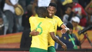 Thalente Mbatha celebrates with Aubrey Modiba