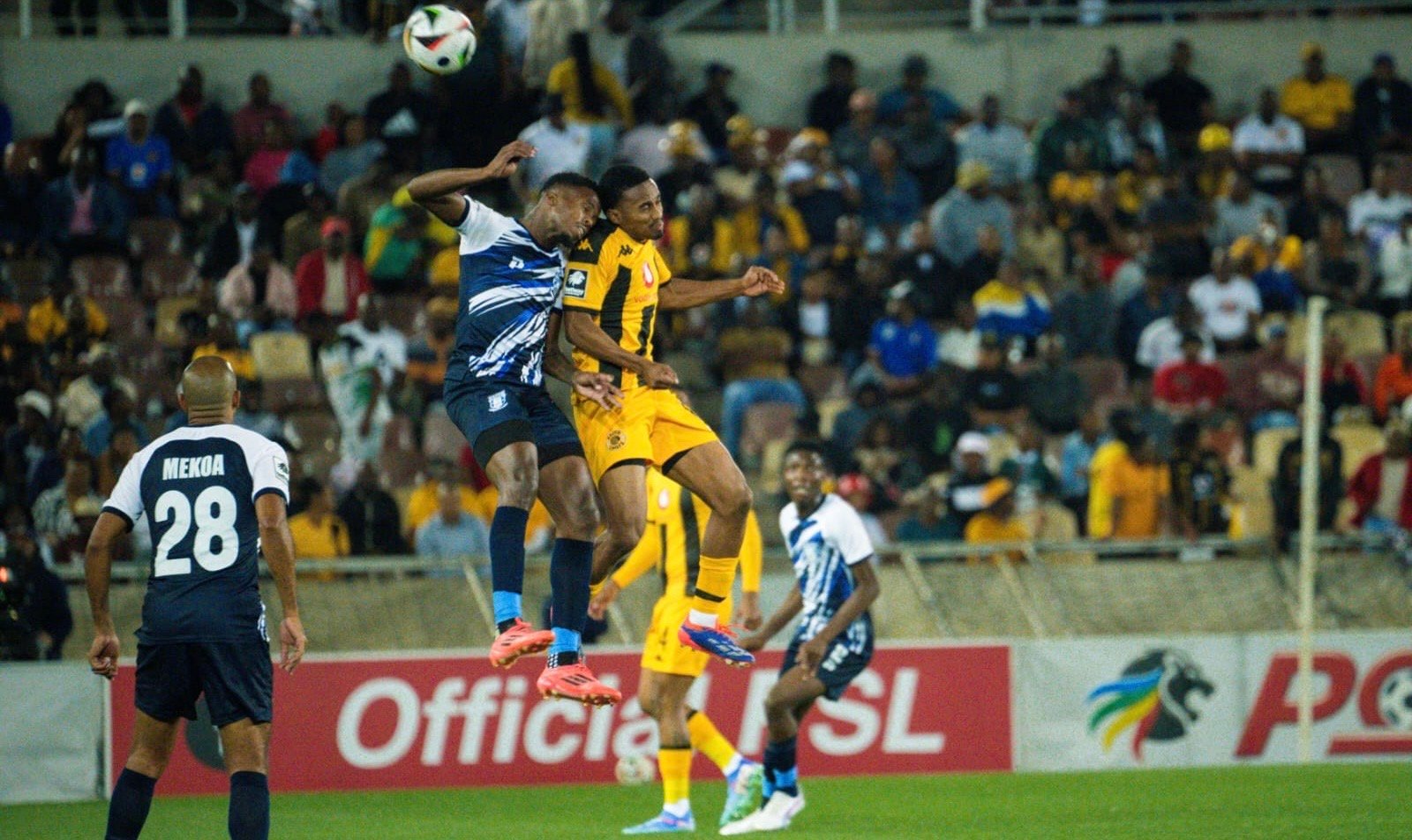 Kaizer Chiefs midfielder Njabulo Blom and Magesi’s Wonderboy Makhubu fighting for the ball in the air