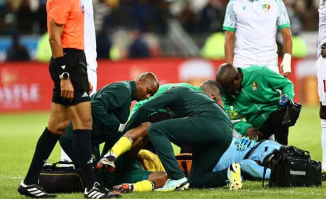 Lyle Foster being attended by medical staff after injury.