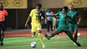 Bathusi Aubaas tackling Allan Okello in the Bafana Bafana vs Uganda AFCON qualifier