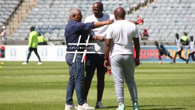 Clinton Larsen of Magesi FC before the Orlando Pirates game talking with other coaches