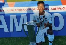 Emile Witbooi holding a trophy with SA under 20 side