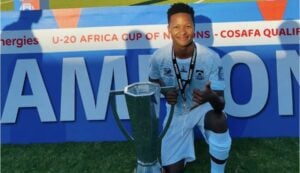 Emile Witbooi holding a trophy with SA under 20 side