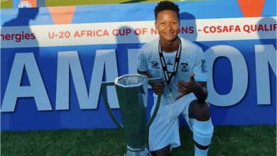 Emile Witbooi holding a trophy with SA under 20 side