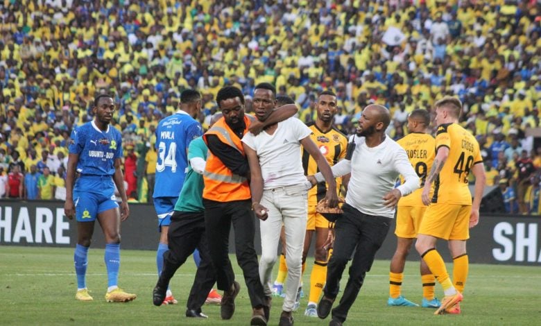 A Kaizer Chiefs fan on the field of play