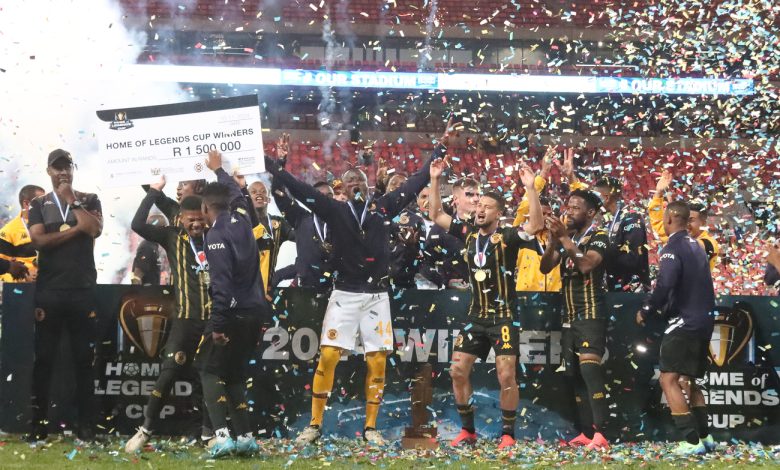 Kaizer Chiefs lifting the trophy with assistant coach Cedric Kaze