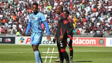 Nkosinathi Sibisis guiding Wonderboy Makhubu in the Carling Knockout Cup match