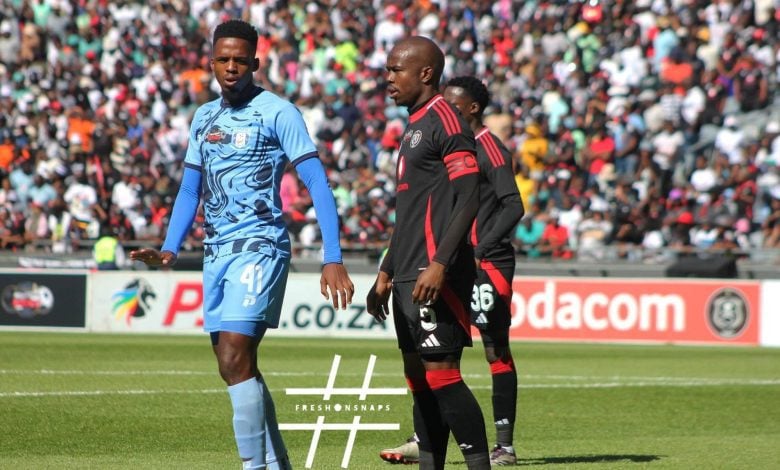 Nkosinathi Sibisis guiding Wonderboy Makhubu in the Carling Knockout Cup match