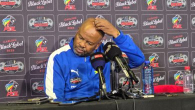 Manqoba Mngqithi scratching his head during the post match conference