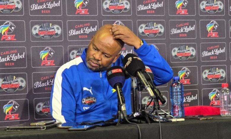 Manqoba Mngqithi scratching his head during the post match conference