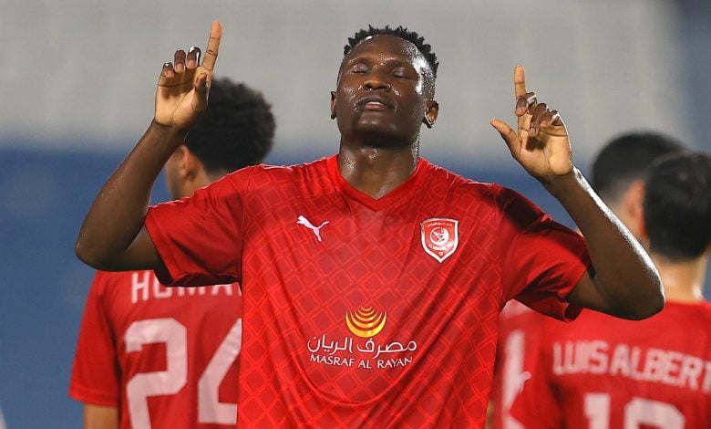 Michael Olunga celebrating after scoring a goal in the colours of Al-Duhail