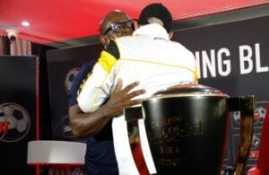 Nasreddine Nabi and Steve Khompela hugging after a press conference