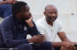 Zimbabwe legend Peter Ndlovu sharing noted with striker Admiral Muskwe during 2026 FIFA World Cup qualifiers.