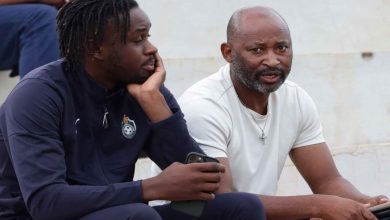 Zimbabwe legend Peter Ndlovu sharing noted with striker Admiral Muskwe during 2026 FIFA World Cup qualifiers.