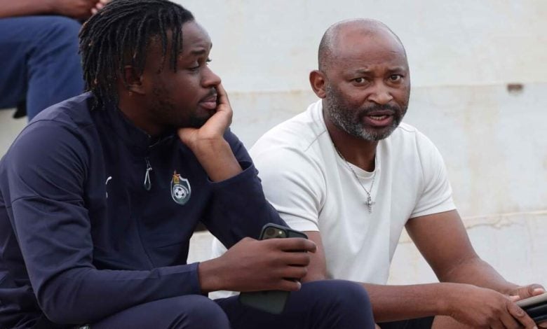 Zimbabwe legend Peter Ndlovu sharing noted with striker Admiral Muskwe during 2026 FIFA World Cup qualifiers.