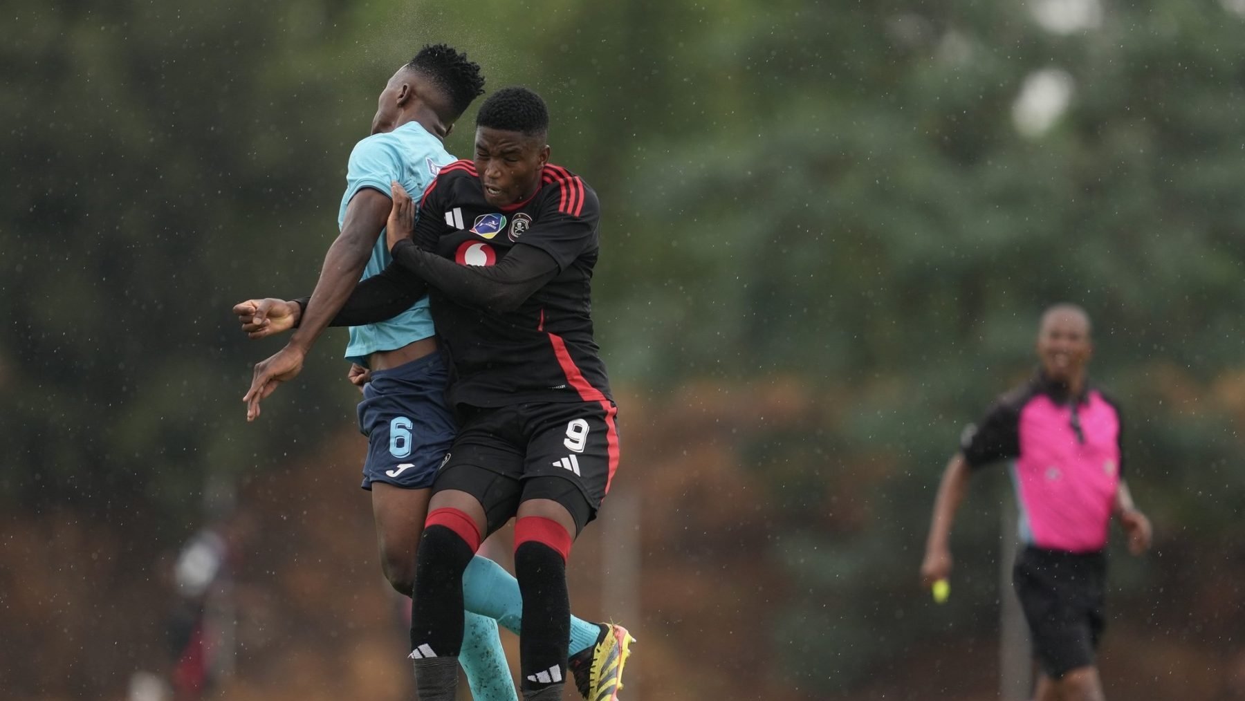 Richards Bay FC player and Orlando Pirates player fighting for a ball during the DDC match 