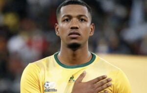 Rushwin Dortley, coached by Hugo Broos singing the national anthem