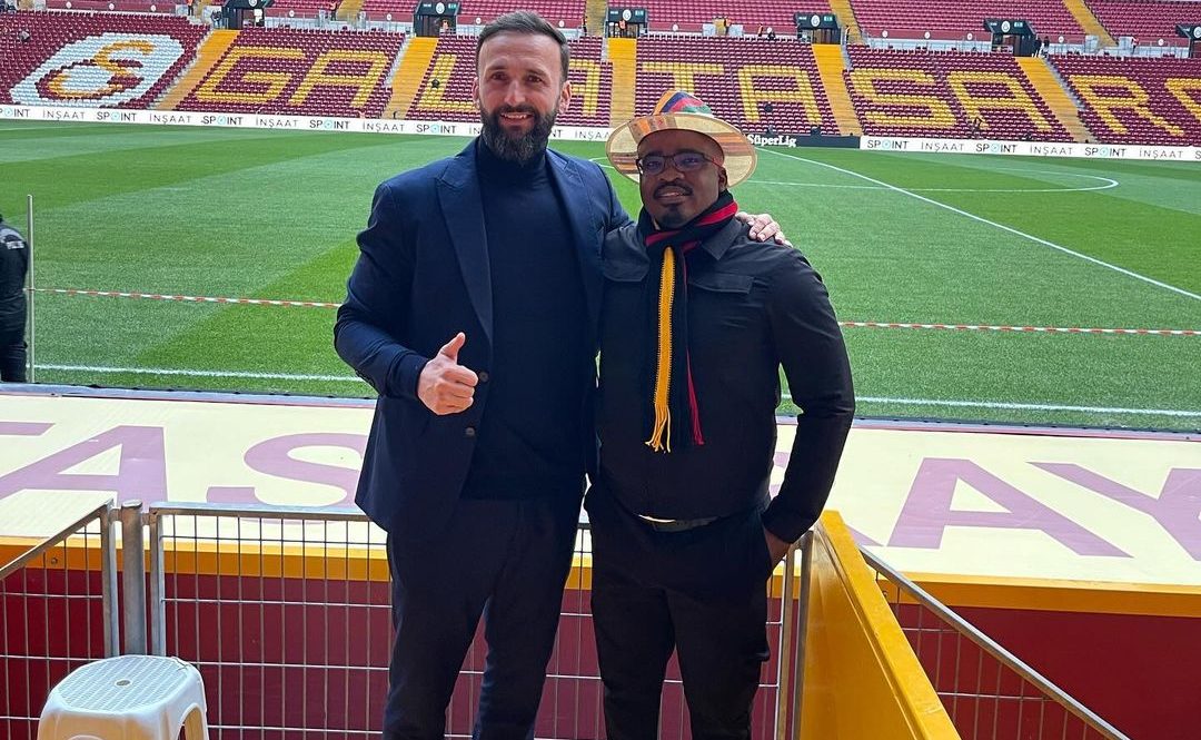 Tim Sukazi and Sead Ramovic posing for a picture at a stadium