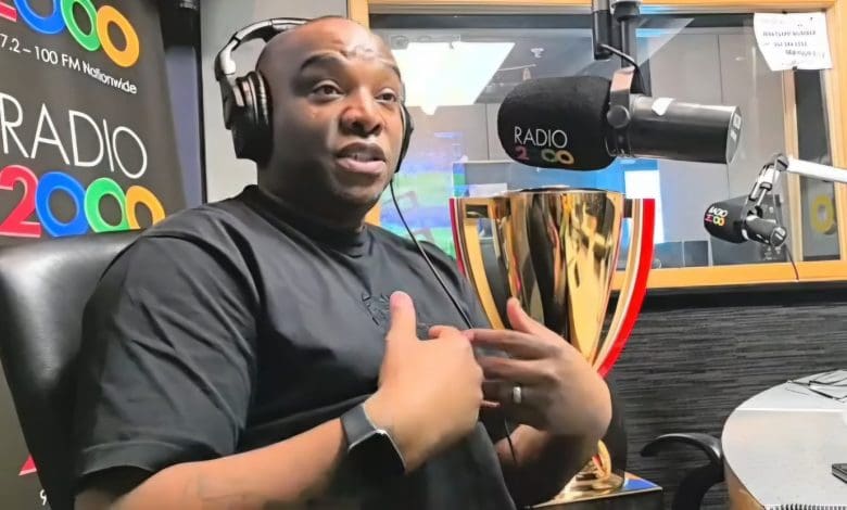 Benni McCarthy pointing at himself during an interview