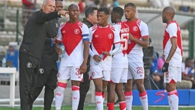 Cape Town Spurs players with coach Ernst Middendorp during a game