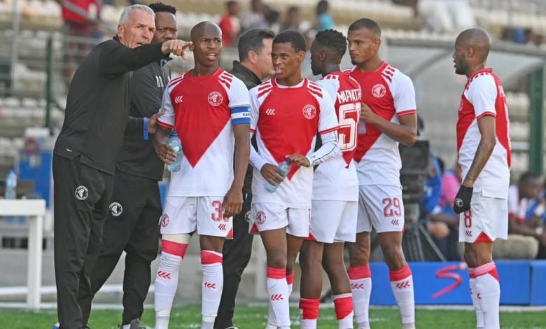 Cape Town Spurs players with coach Ernst Middendorp during a game