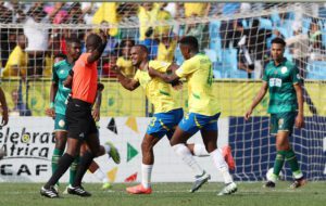 Iqraam Rayners celebrating a goal with his Mamelodi Sundowns teammates. The team is coached by Miguel Cardoso