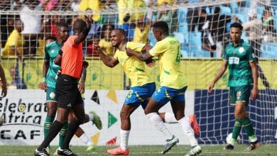 Iqraam Rayners celebrating a goal with his Mamelodi Sundowns teammates. The team is coached by Miguel Cardoso