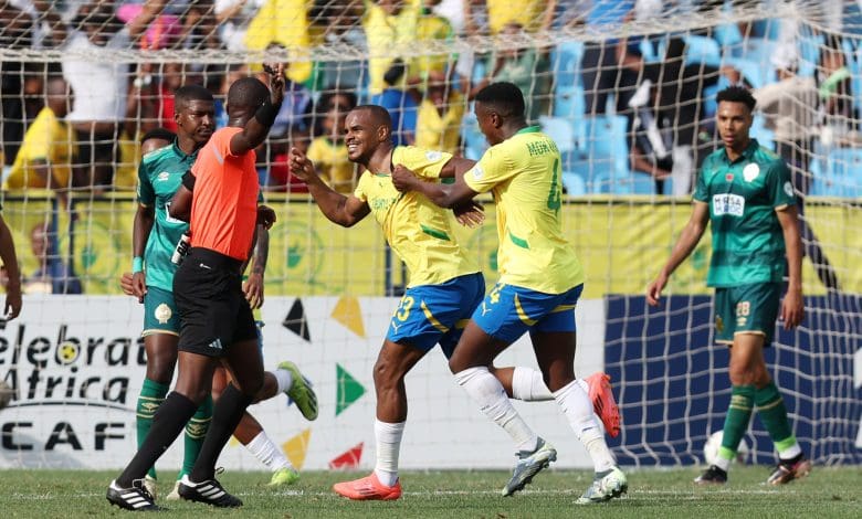 Iqraam Rayners celebrating a goal with his Mamelodi Sundowns teammates. The team is coached by Miguel Cardoso