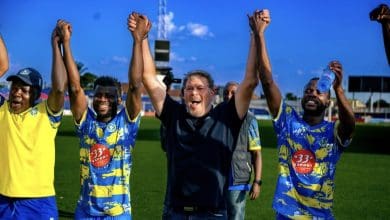 Luc Eymael with the players celebrating