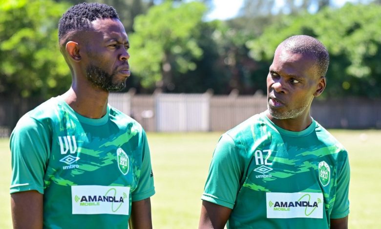 Vusumuzi Vilakazi and Arthur Zwane having a chat at the training grounds