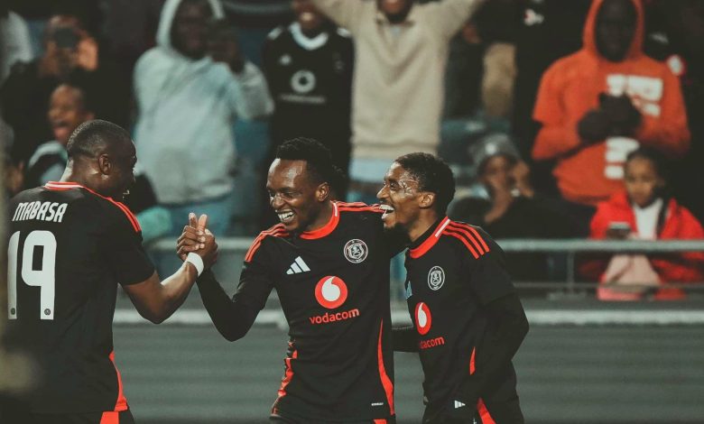 Monnapule Saleng and Patrick Maswanganyi celeberating a goal with an Orlando Pirates teammate