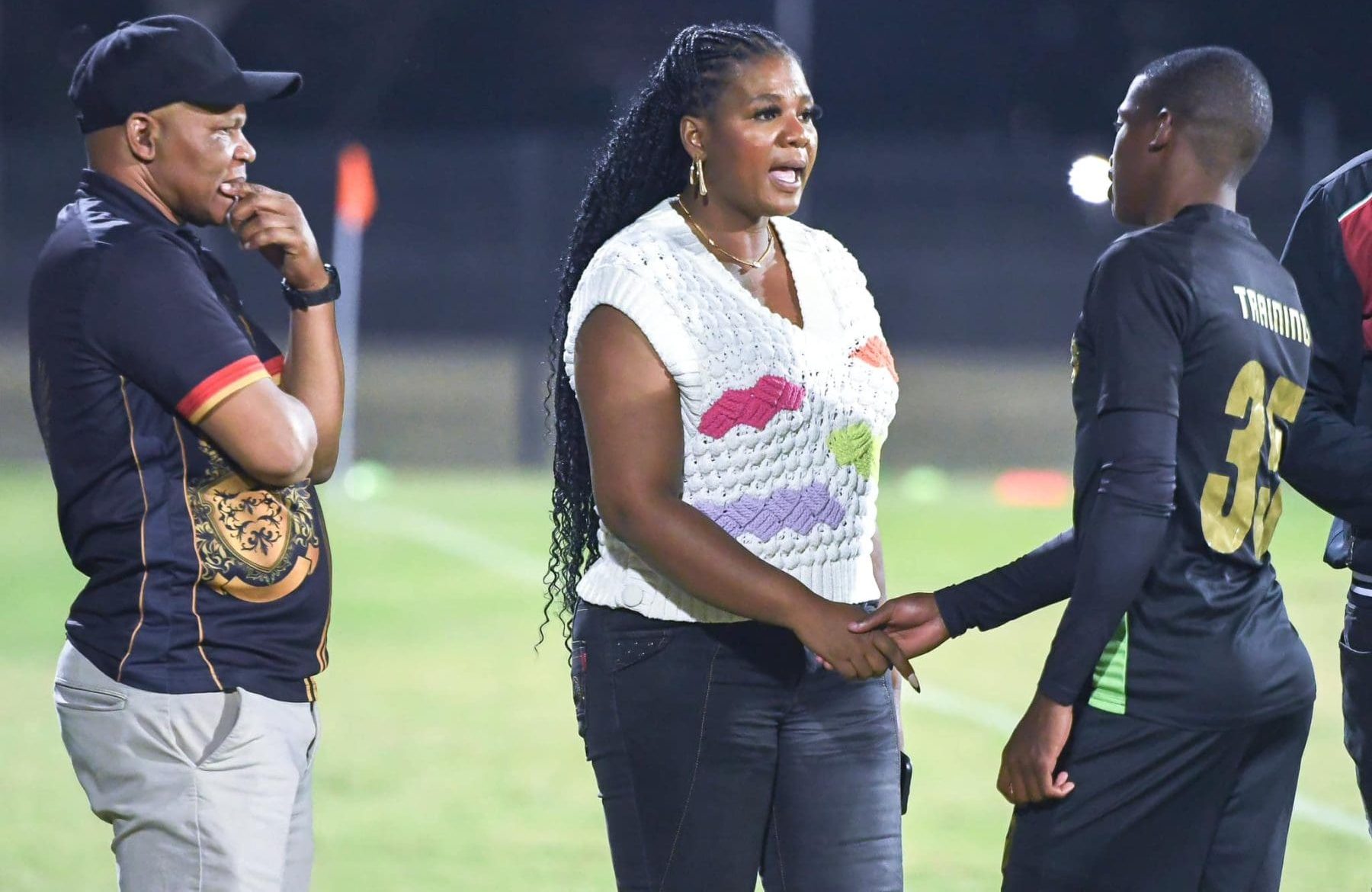 Shauwn Mkhize with John Maduka and a Royal AM player after a game