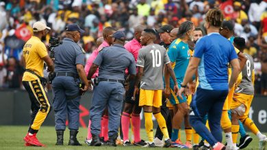 Kaizer Chiefs players with police protesting the match officials after the Soweto Derby against Orlando Pirates