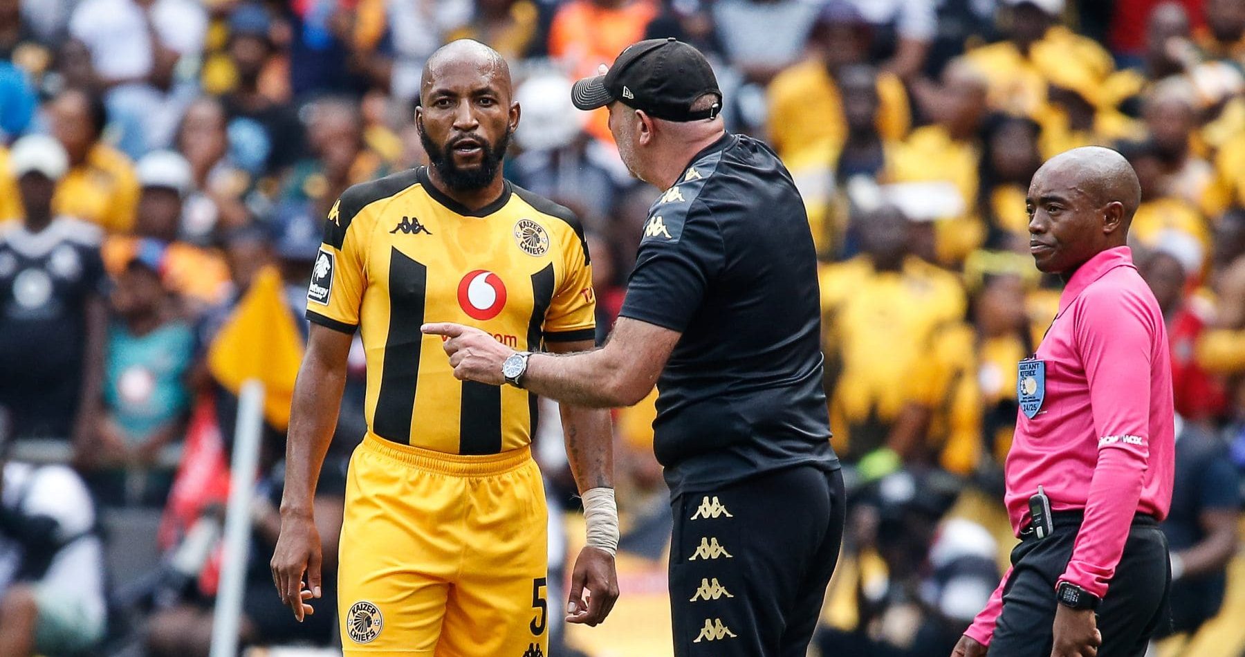 Nasreddine Nabi, coach of Kaizer Chiefs, giving an instruction to midfielder Sibongiseni Mthethwa.