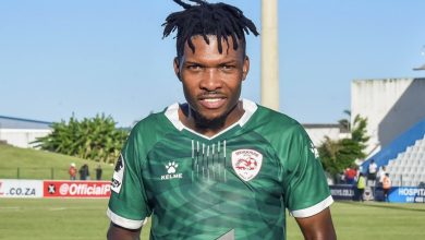 Sekhukhune United player Shaune Mogaila holding a Man of the Match trophy