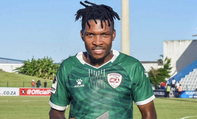 Sekhukhune United player Shaune Mogaila holding a Man of the Match trophy