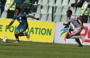 Aviwe Mqokozo of Chippa United in pursuit of AmaZulu’s Rowan Human, who controls the ball.