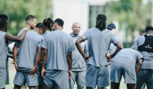 Nigeria coach Eric Chelle conducting a team talk with his players.