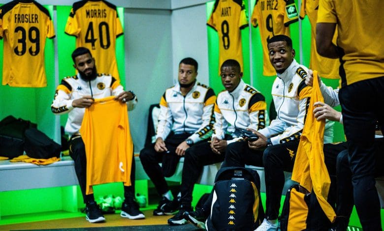 Kaizer Chiefs players in the change before a game having a chat