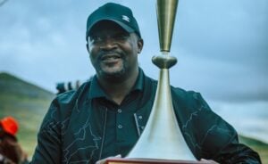 Coach Lehlohonolo Seema lifting the People's Cup