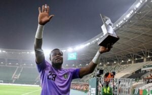 Nigeria goalkeeper Stanley Nwabali holding a trophy during the Africa Cup of Nations.