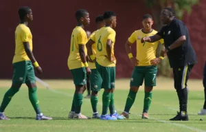 Amajimbos coach Vela Khumalo and his players