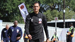 Andre Arendse arriving at the stadium alongside his technical staff members.