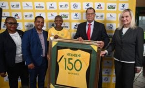 Danny Jordaan and Nompumelelo Nyandeni and other posing for a picture