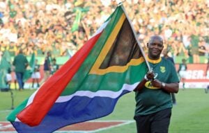 Former Bafana Bafana coach Pitso Mosimane with the SA flag