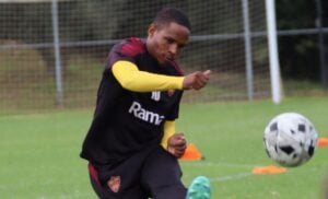 Stellenbosch FC striker Lehlohonolo Mojela kicking a ball.