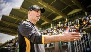 Kaizer Chiefs coach Nasreddine Nabi stretching his hand to shake