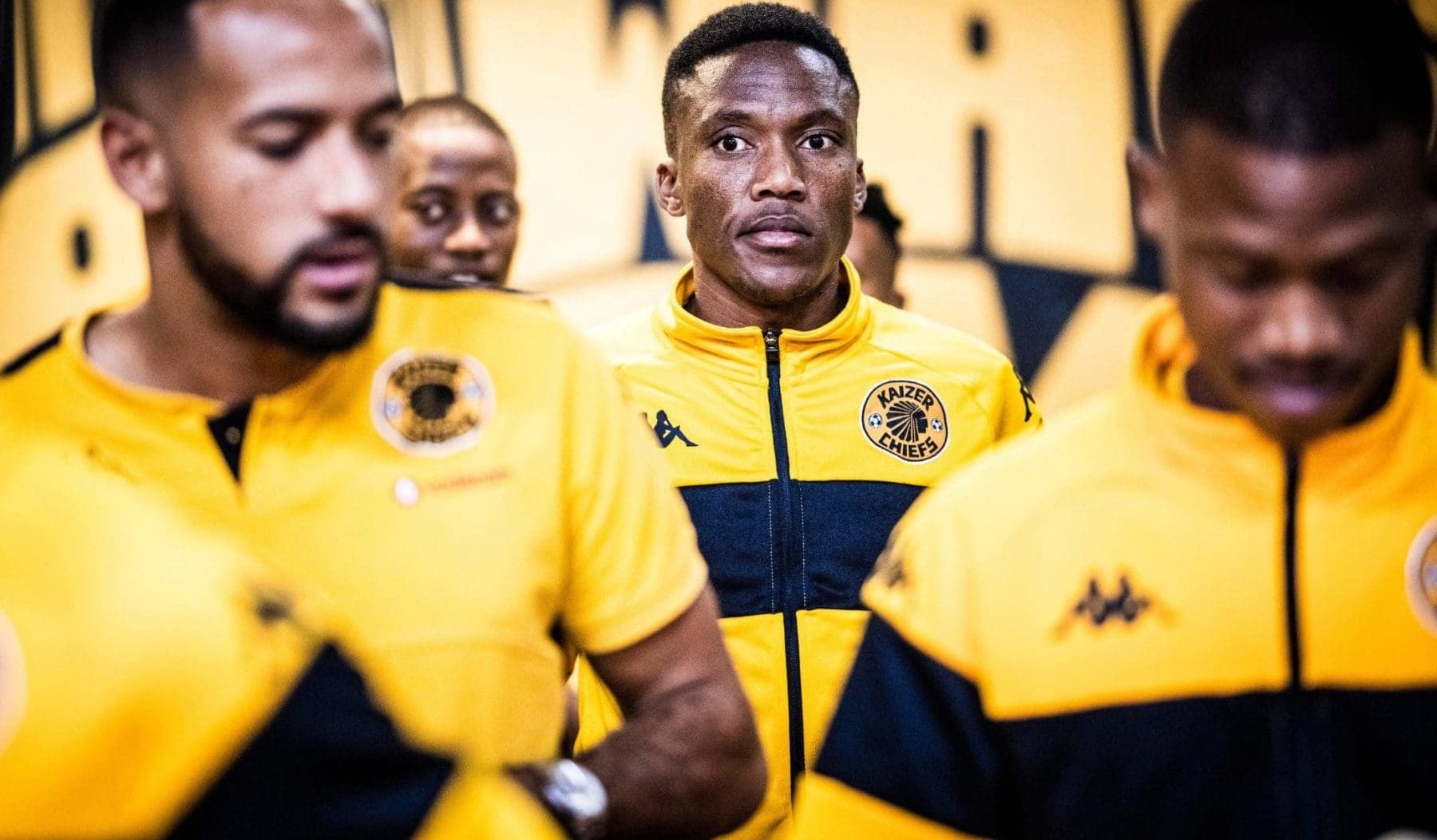 Pule Mmodi of Kaizer Chiefs walking with teammates 
