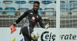 Orlando Pirates goalkeeper Sipho Chaine kicking a ball.