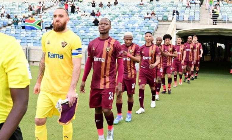 Stellenbosch FC players heading into the pitch